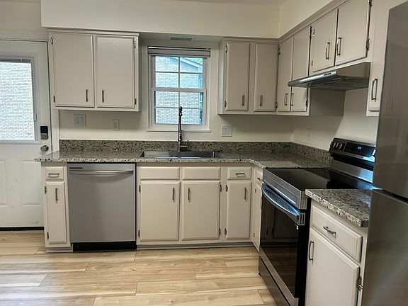 kitchen view, new fiberglass back door with coded entry and built-in blinds