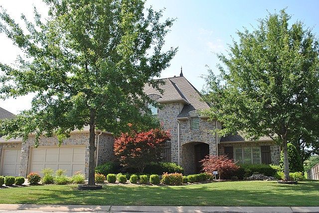 Stately brick and stone home in Jenks