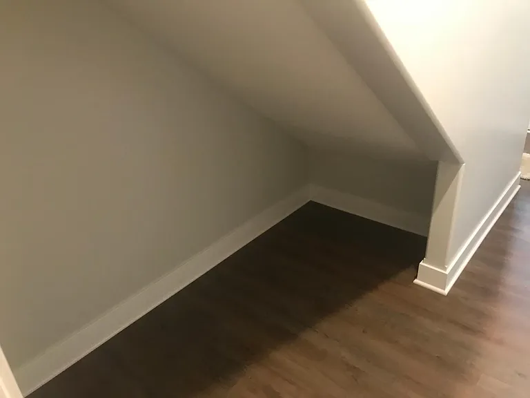 Lower level storage below stairs
