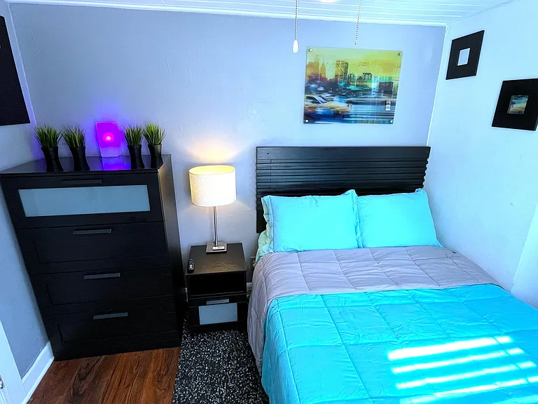 Features: Full bed, 55" Roku Smart TV, Personal AC, Ceiling fan, dresser, night stand with lamp and shag rug