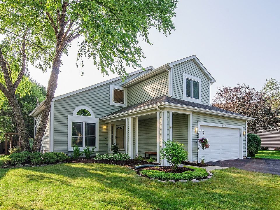 Welcoming & warm ~ front porch welcomes you home ~ 2 car garage with a new 3 car driveway & bay ~ NEWER windows, siding, gutters, roof, fascia ~ wrapped trim!