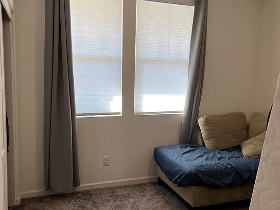 downstairs bedroom with adjacent bathroom