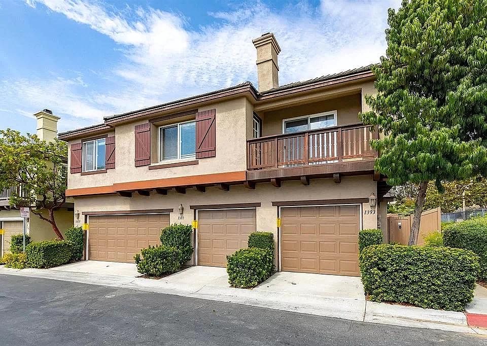 Condo exterior with attached garage.