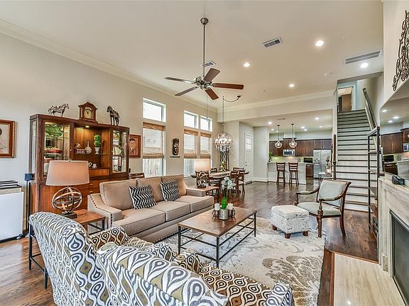 Open floor plan with this first floor living space and Kitchen. Hard wood flooring and extra tall ceilings through out the space.