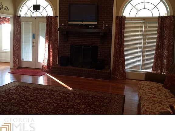 Spacious Family Room's Brick Fireplace