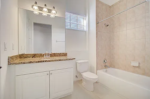 Aberdeen - Secondary Bathroom with tub and granite countertops
