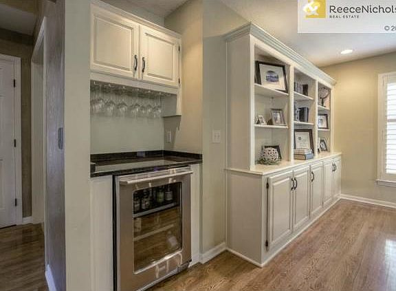 Check out the built-ins on the back wall.  The wine/beverage fri