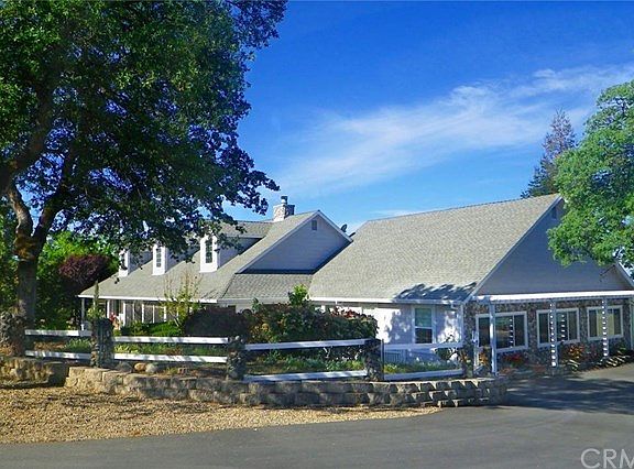 Front view of house and landscaping, as seen from circle drive.