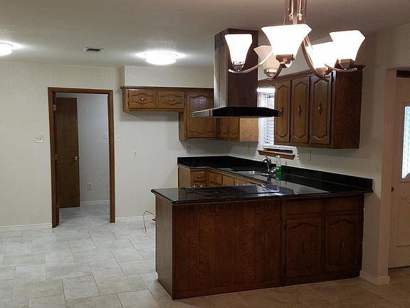 granite counter tops, hard surface flooring in living areas.