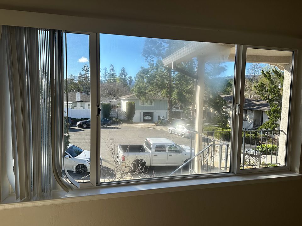 Living Room View or private court and slight view of hills.