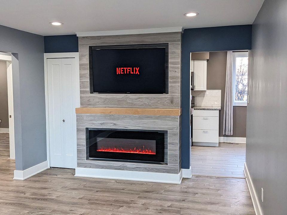 Living Room electric fireplace and 55" TV (view from just inside front door)