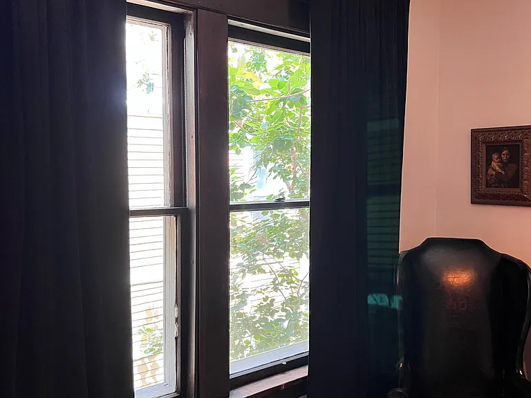 Heavy velvet drapes in dining room.