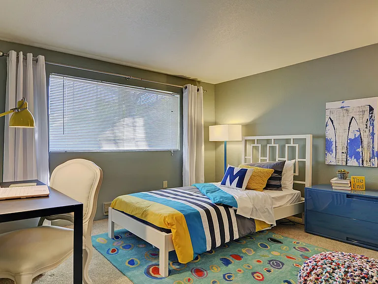 Spacious guest bedroom with over sized window
