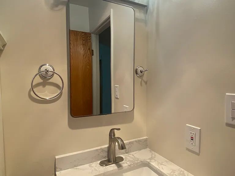 New sink, vanity and lights in bathroom