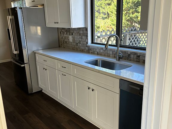 New kitchen dishwasher, refrigerator - kitchen overlooks spacious backyard.