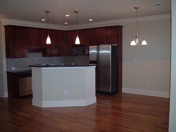 modern kitchen with granite and stainless steel appliances