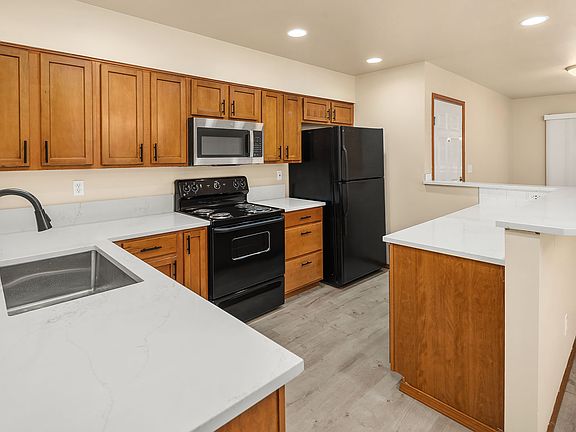 updated kitchen with solid quartz counters