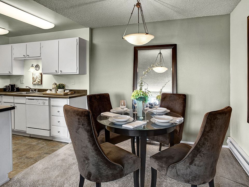 Dining area with overhead lighting and easy access to the kitchen