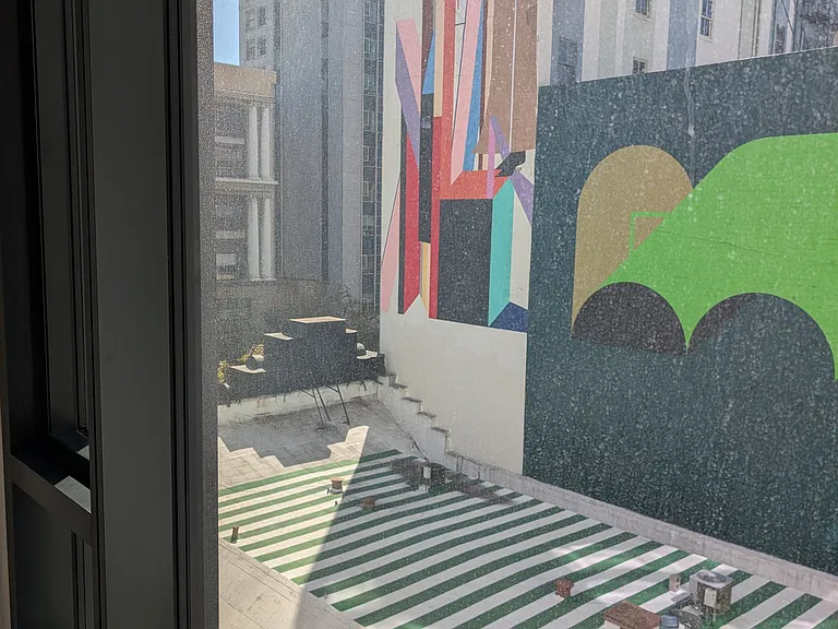 Light-filled unit set-back from street to minimize noise - view of Claire Rojas - Sharing Flowers and Hasegawa Mural