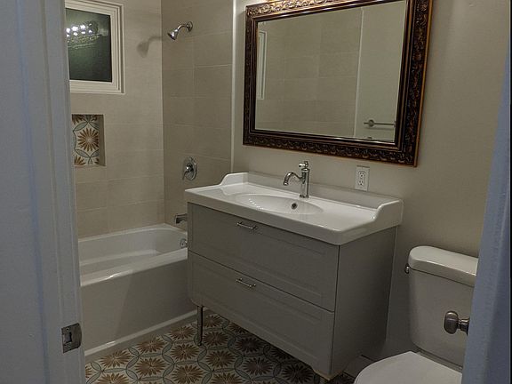 Bathroom - full bath with retro style tiling