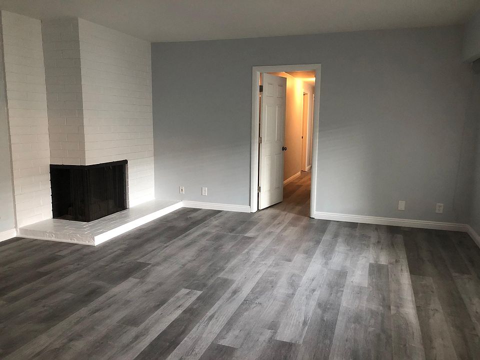 Spacious living room with gas fireplace.