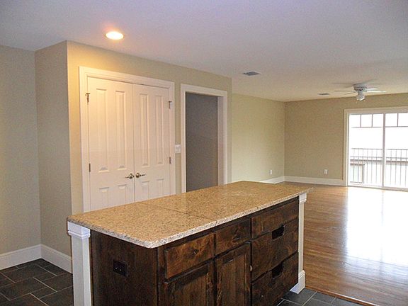 Kitchen opens into large living room.