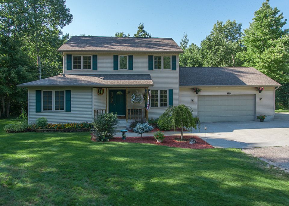 LISTEN TO THE QUIET.   Nestled on a picturesque 3.8 wooded acres you will have privacy without isolation.   This property is close to schools and an easy 5 minute drive to downtown Midland.   This house has been loved, and it shows.  It is all ready for new buyers to enjoy.  Recent improvements are the back yard deck and paver patio that is absolutely beautiful and surrounded by beautiful landscaping and trees.  The finished basement has a family room and half bath.  The spacious main floor great room has beautiful hickory hardwood floors.  The 4th bedroom is on the main floor with a full bath and could also be a main floor den.   For those seeking a beautiful home, private lifestyle and beautiful surroundings, this is a must see property.    Welcome Home!
