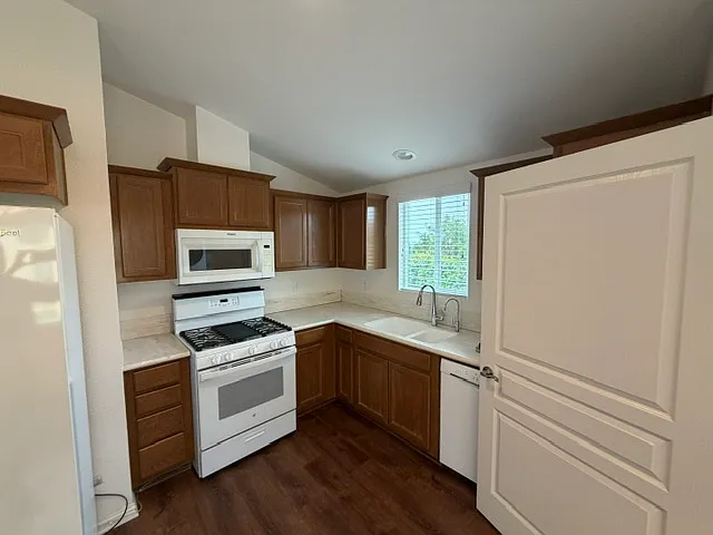 All new appliances and RO; more cabinet space behind that door, which closes off the laundry room