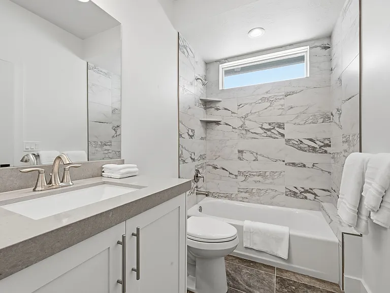 Full sized bathroom with shower and tub