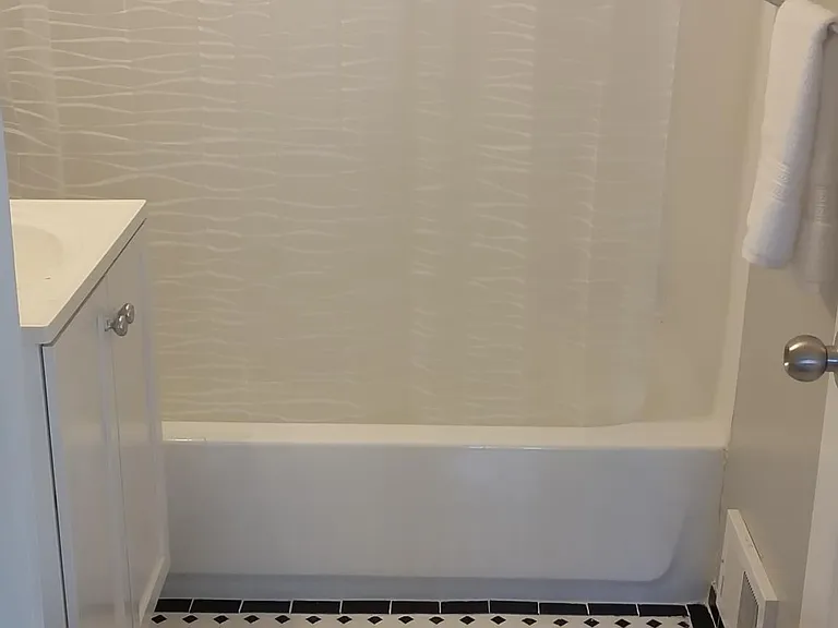 Bathroom 1 - new tub, tile and vanity