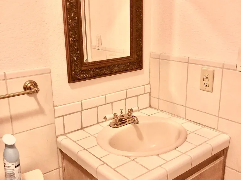 2 story bathroom shared between both upstairs rooms