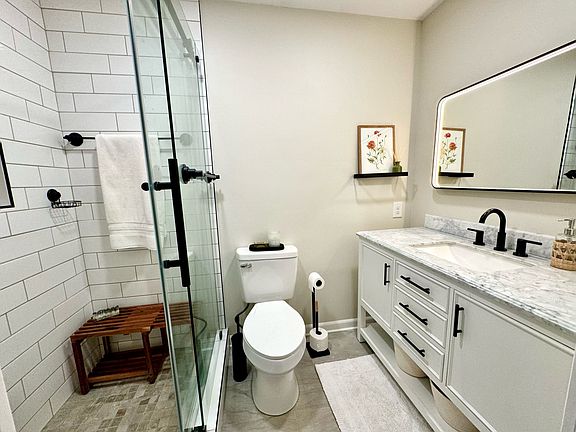 Updated master bathroom - standing tile shower with rainfall shower head and detachable shower handle
