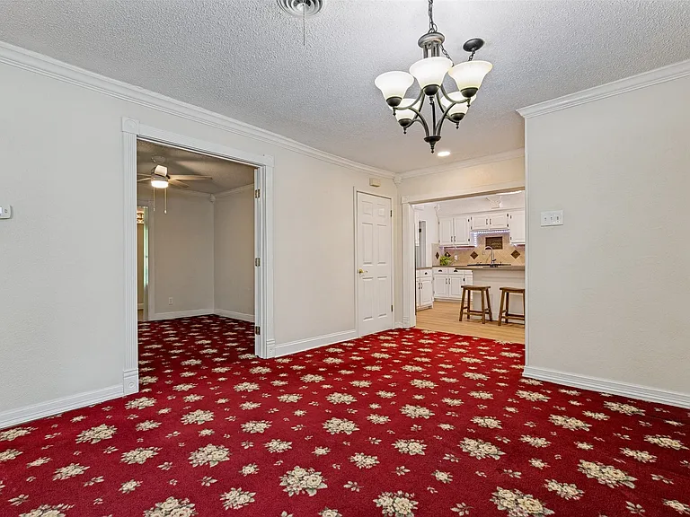 Dining space looking towards kitchen and bedroom 2