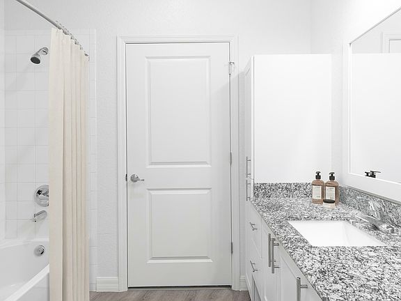 Experience luxury with this stylish bathroom featuring sleek finishes.