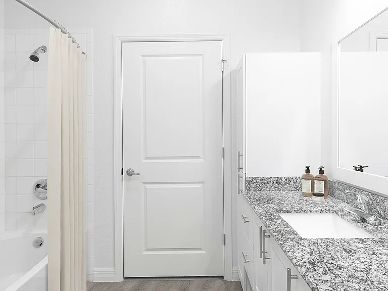 Experience luxury with this stylish bathroom featuring sleek finishes.