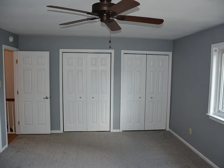 Two closets in primary bedroom