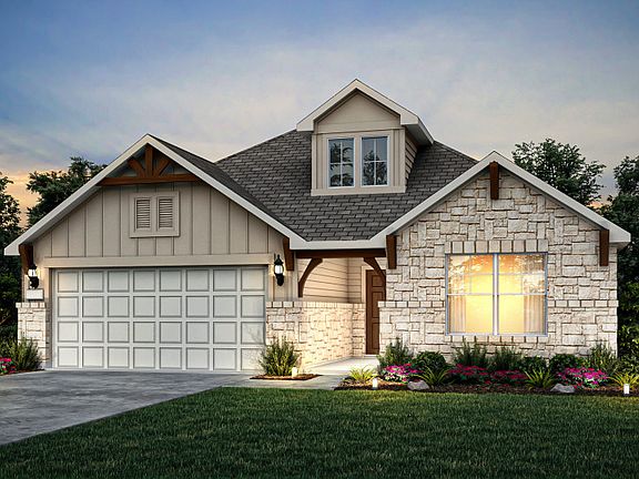 Exterior M with stone accents and a 2-car garage