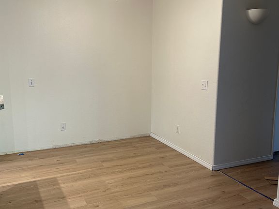 Dining room with new flooring and ceiling fan