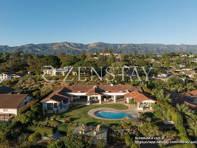 Single-story estate with classic tile roof and expansive frontage