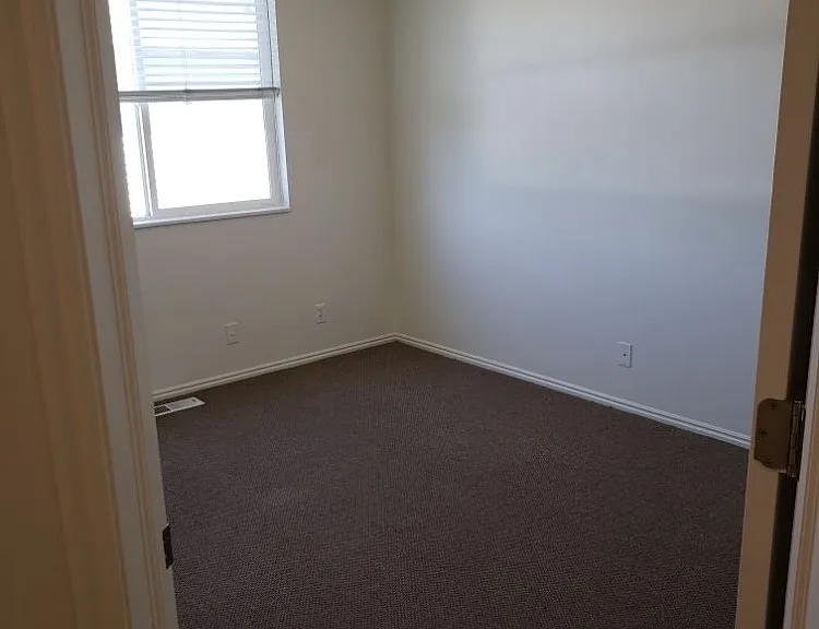 Second bedroom. Large window and two large closets.