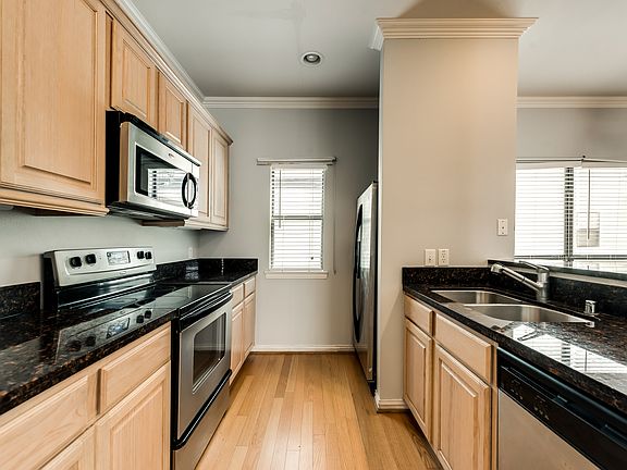 Kitchen also features a double, under-mount sink and a side-