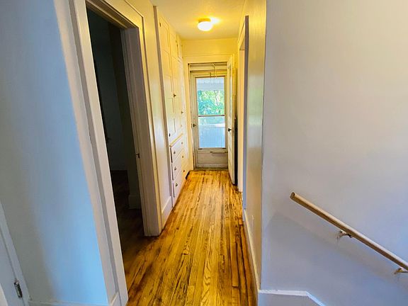 Upstairs hallway with access to 2d floor porch