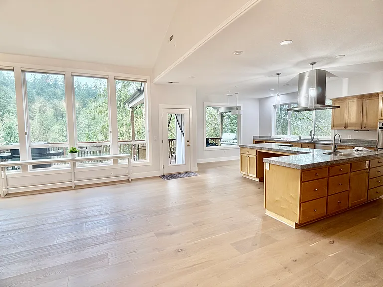 View from the walkway showcasing abundant natural light and serene forested surroundings.