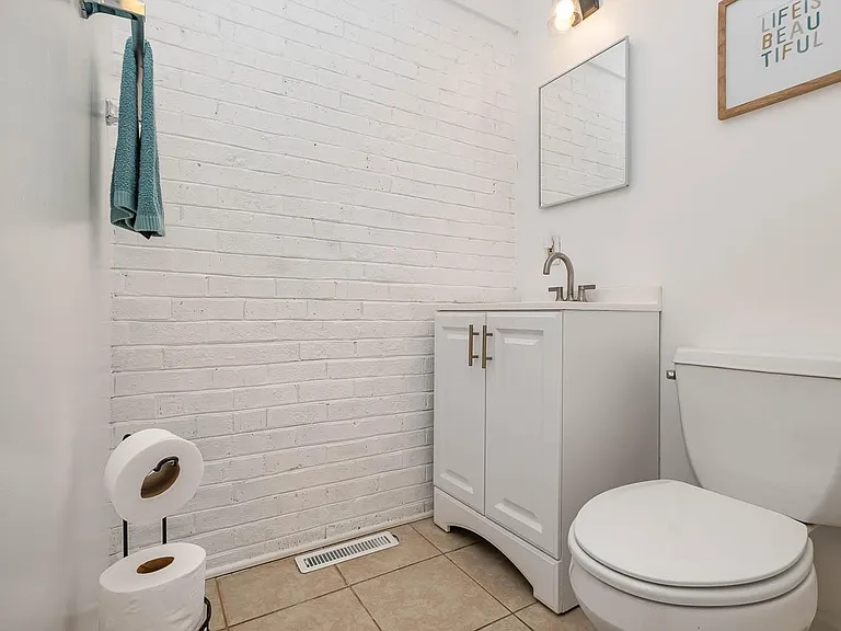 Second bathroom includes a standup shower and linen closet.