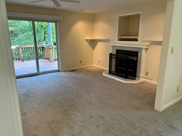 Great room showing sliding glass doors to main deck