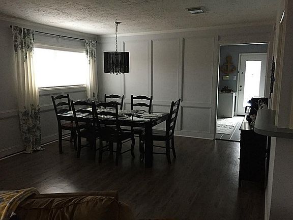 The Dining Room is off of the large Family Room and Kitchen.  It also leads out to the Sun Room.