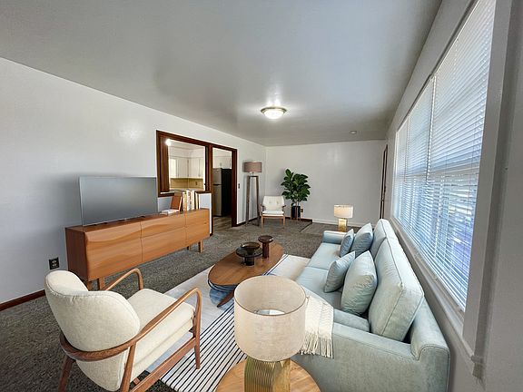 Living Room - Furniture is styled to show how modern furniture would look, but any style of furniture will make it homey.