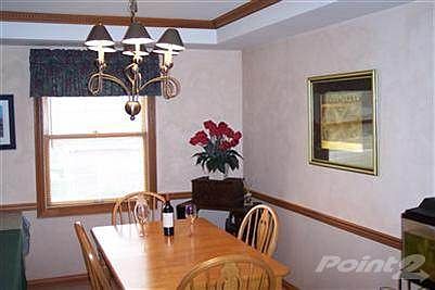 Dining room with tray ceiling, crown mould, chair rail and new light fixture!