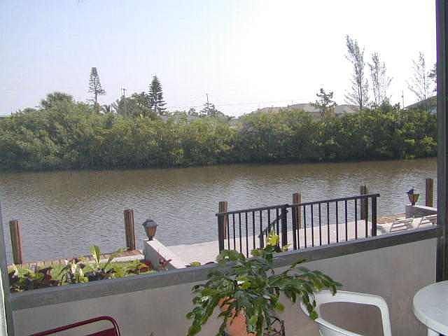 Spacious views of intersecting canals from inside condo