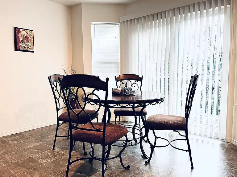 Dining nook with bright windows and great patio for BBQ